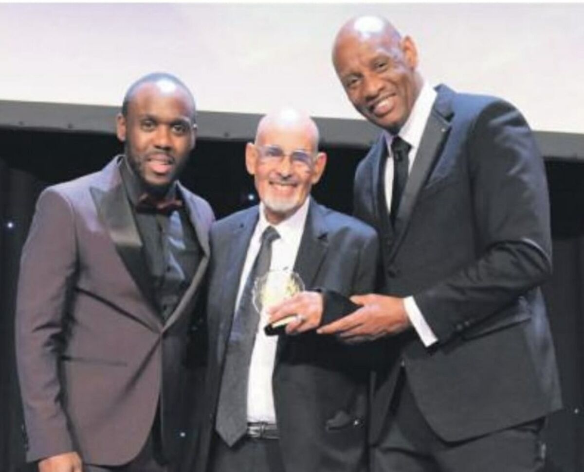 Saleh receiving an award